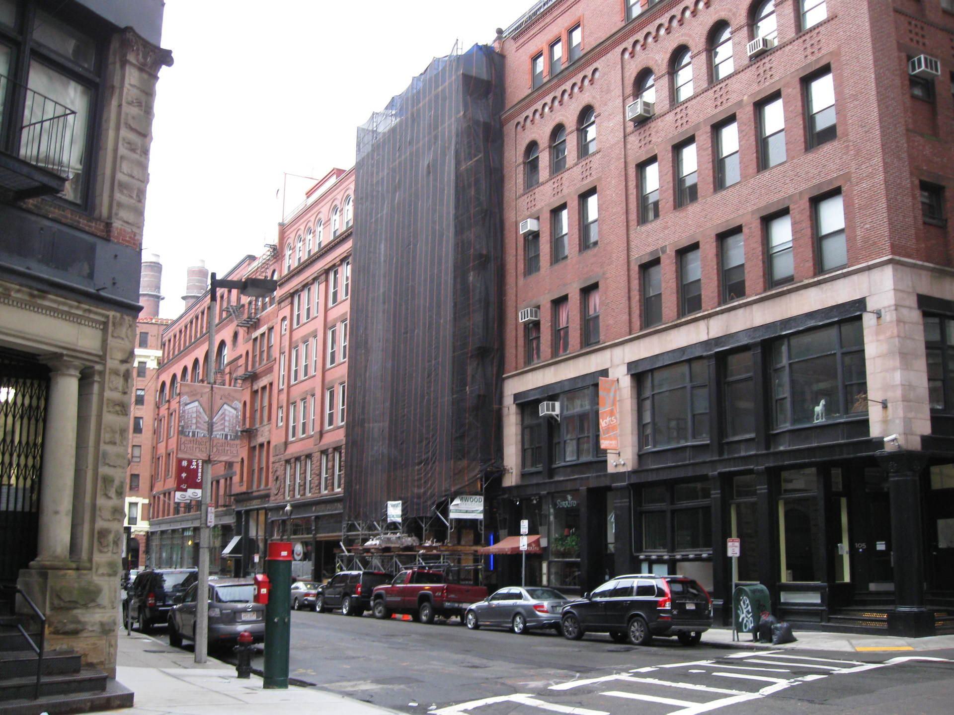 Building under construction with black safety net