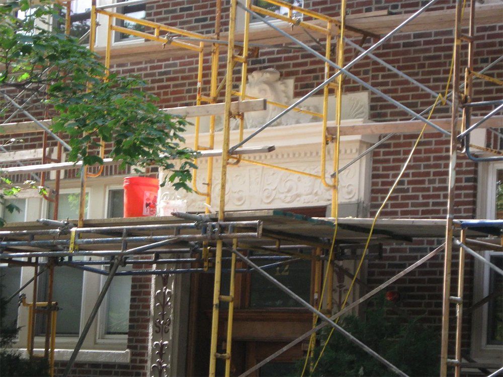 Replaced decorative stonework above portico roof front entrance