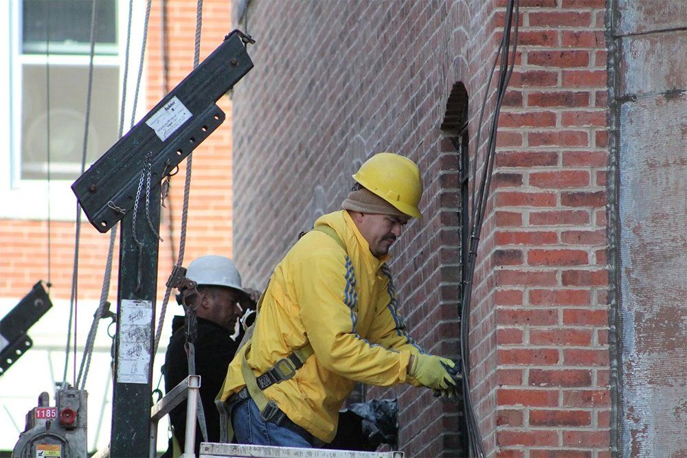 Masonry re-pointing work on rear and side alley elevation of building