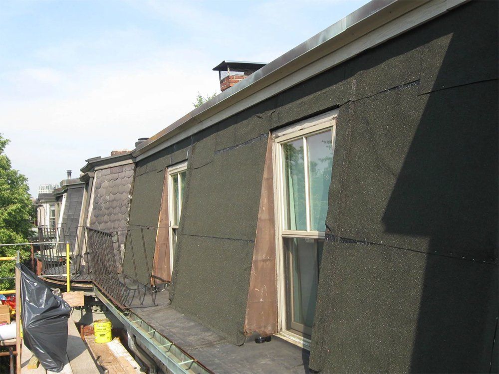 Mansard slate roof replacement and re-pointing work