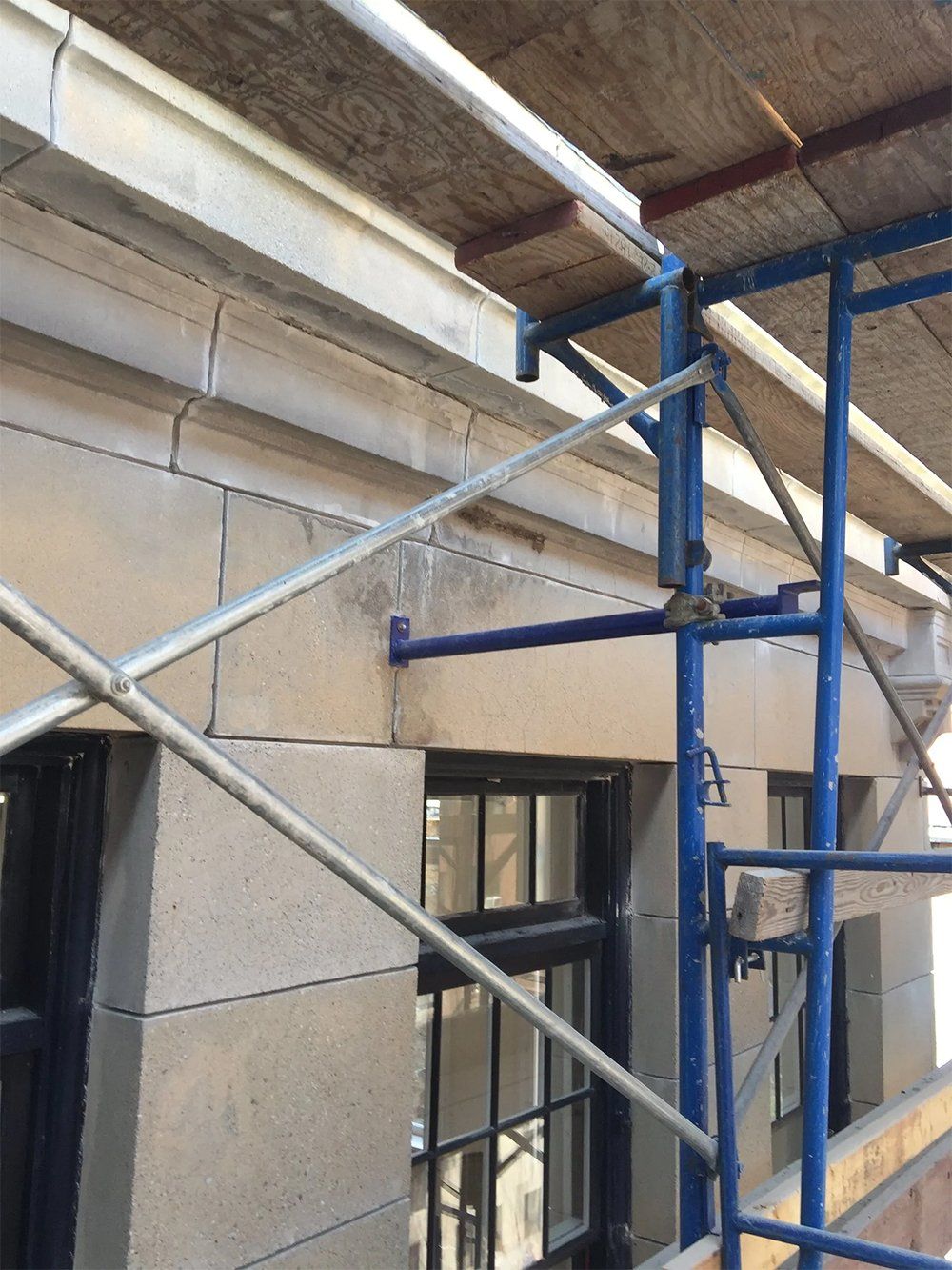 Building repairs to the front elevation and the inside of parapet walls