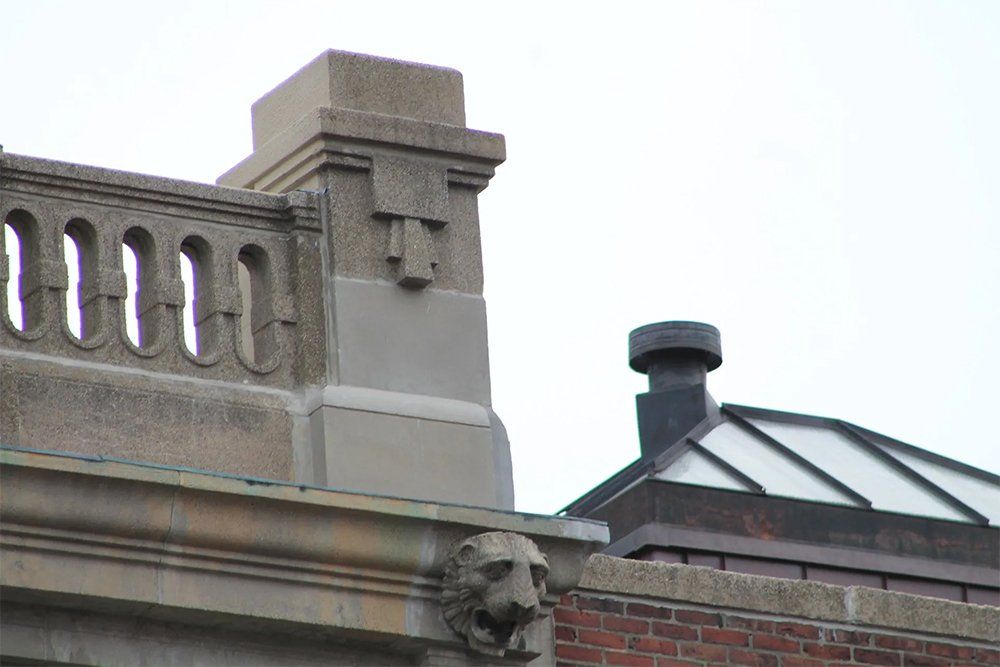 Building repairs to the front elevation and the inside of parapet walls