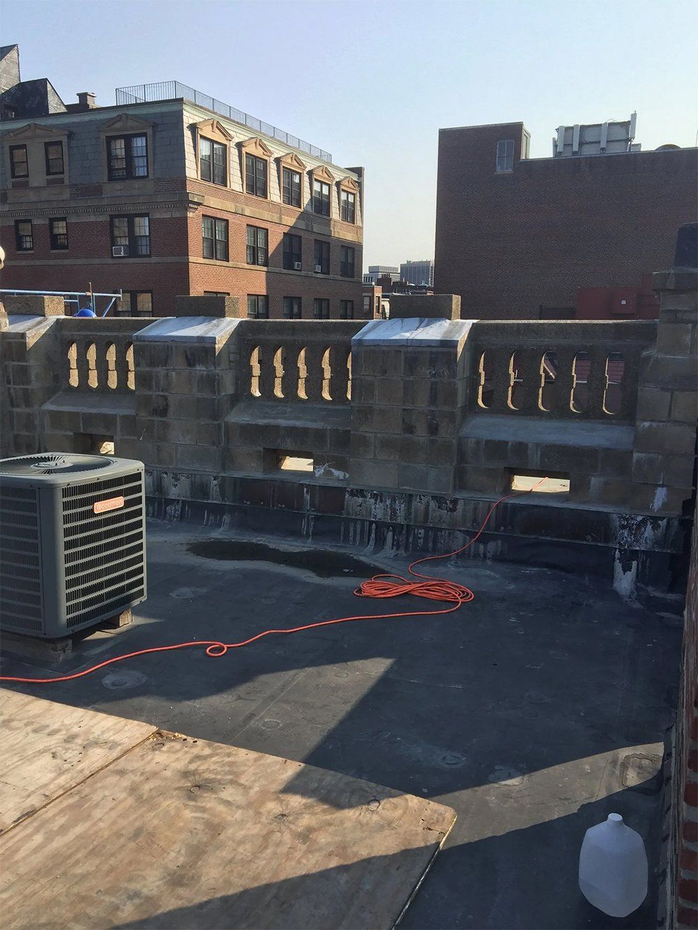 Building repairs to the front elevation and the inside of parapet walls