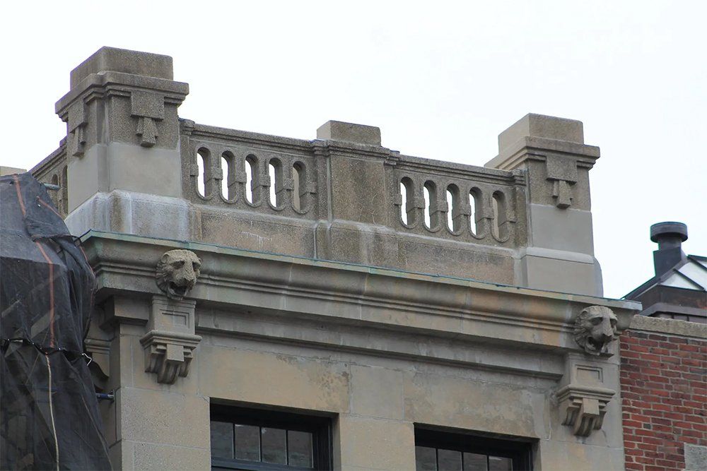 Building repairs to the front elevation and the inside of parapet walls