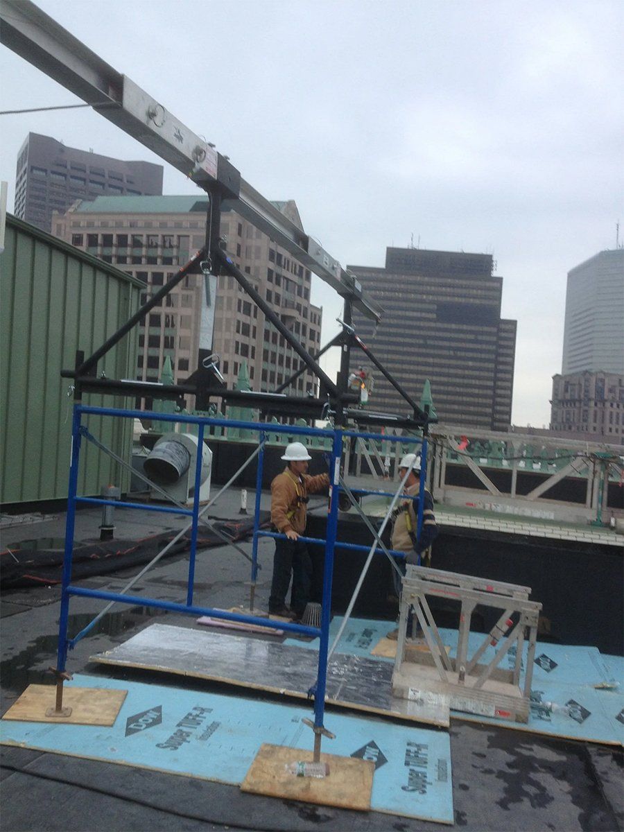Repairs being made on the roof of a building