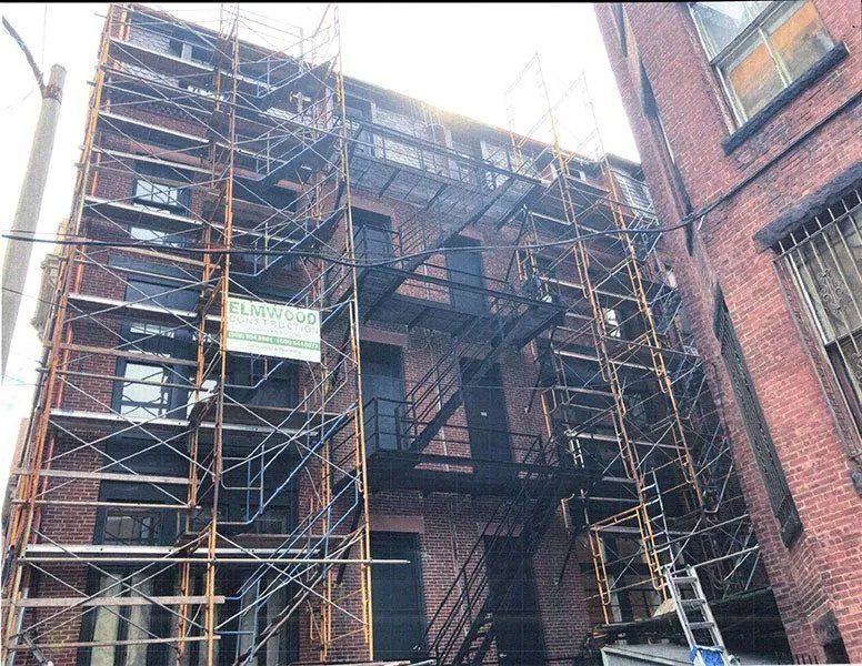 Exterior masonry repairs and mansard roof replacement