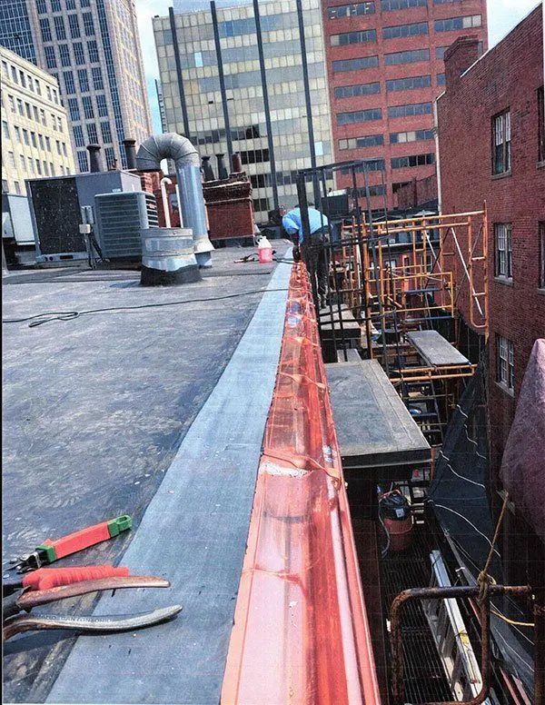 Exterior masonry repairs and mansard roof replacement