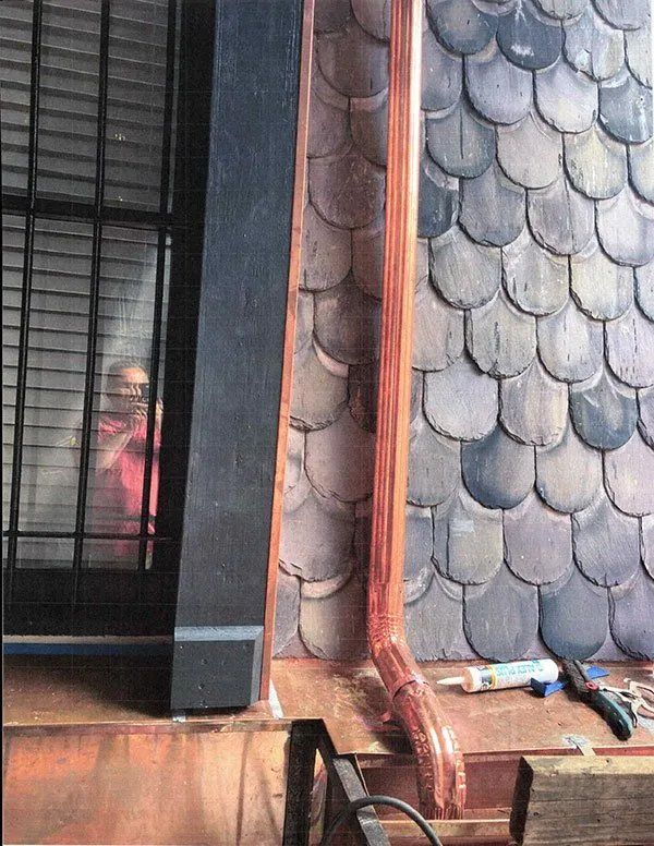 Exterior masonry repairs and mansard roof replacement