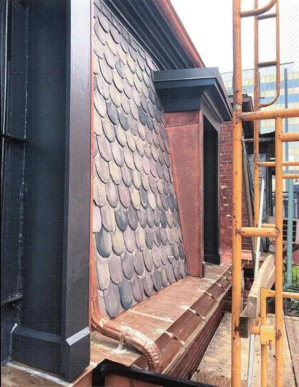 Exterior masonry repairs and mansard roof replacement