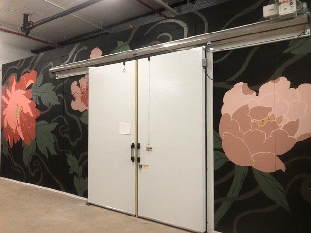A sliding door with flowers painted on it