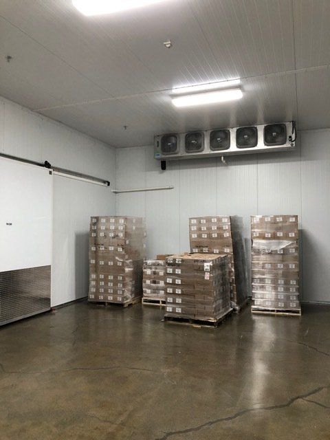 A warehouse filled with lots of boxes and pallets