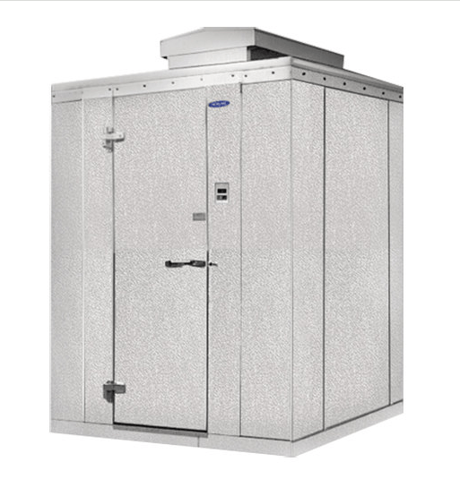 A small white building with a door and a roof