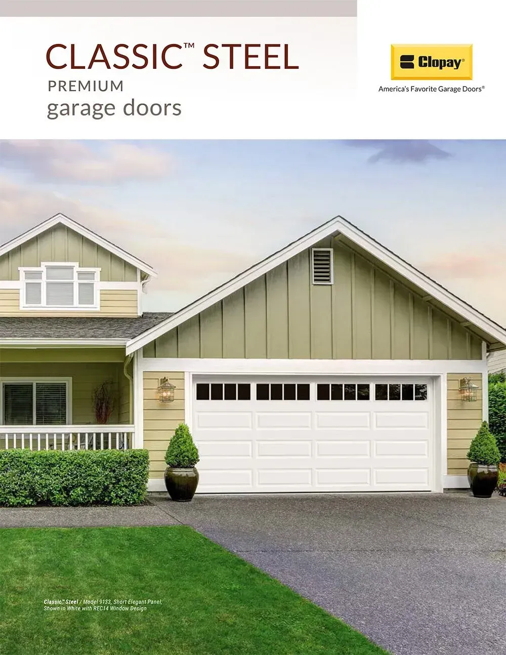 Classic Steel premium garage doors on a light green house with a two-car white garage door.