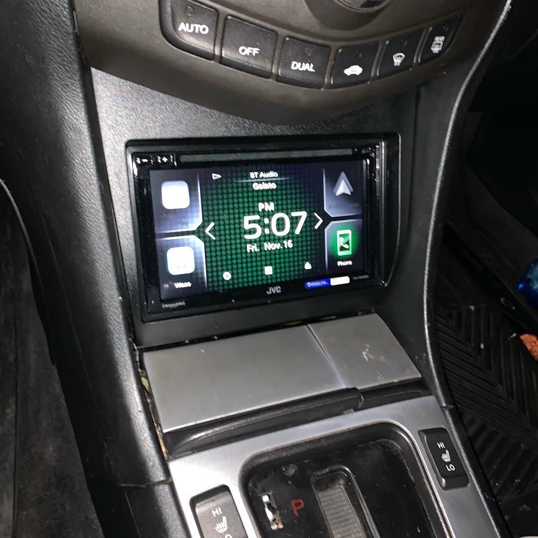 A car radio displays the time as 5:07