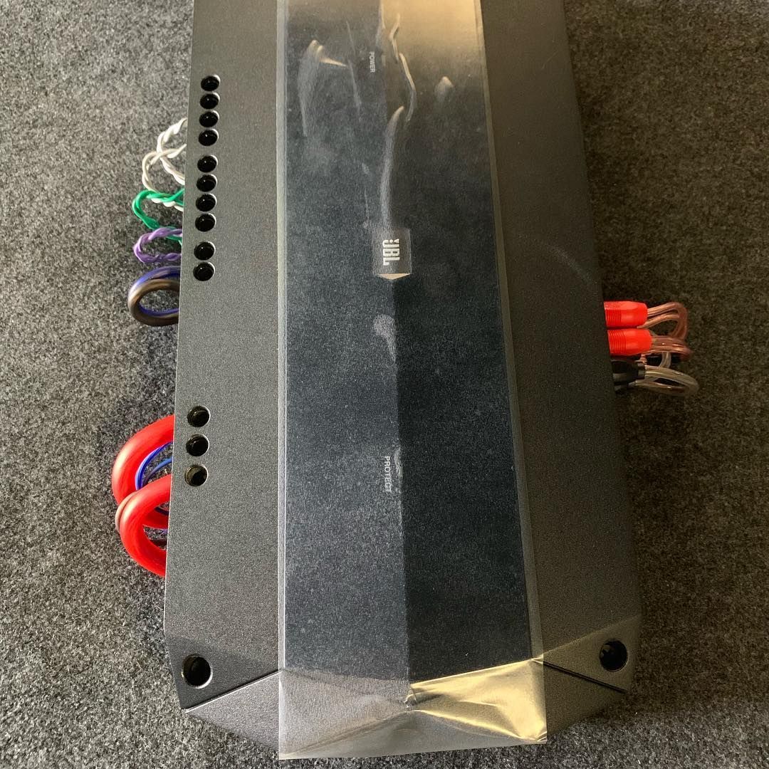 A black box with a lot of wires coming out of it