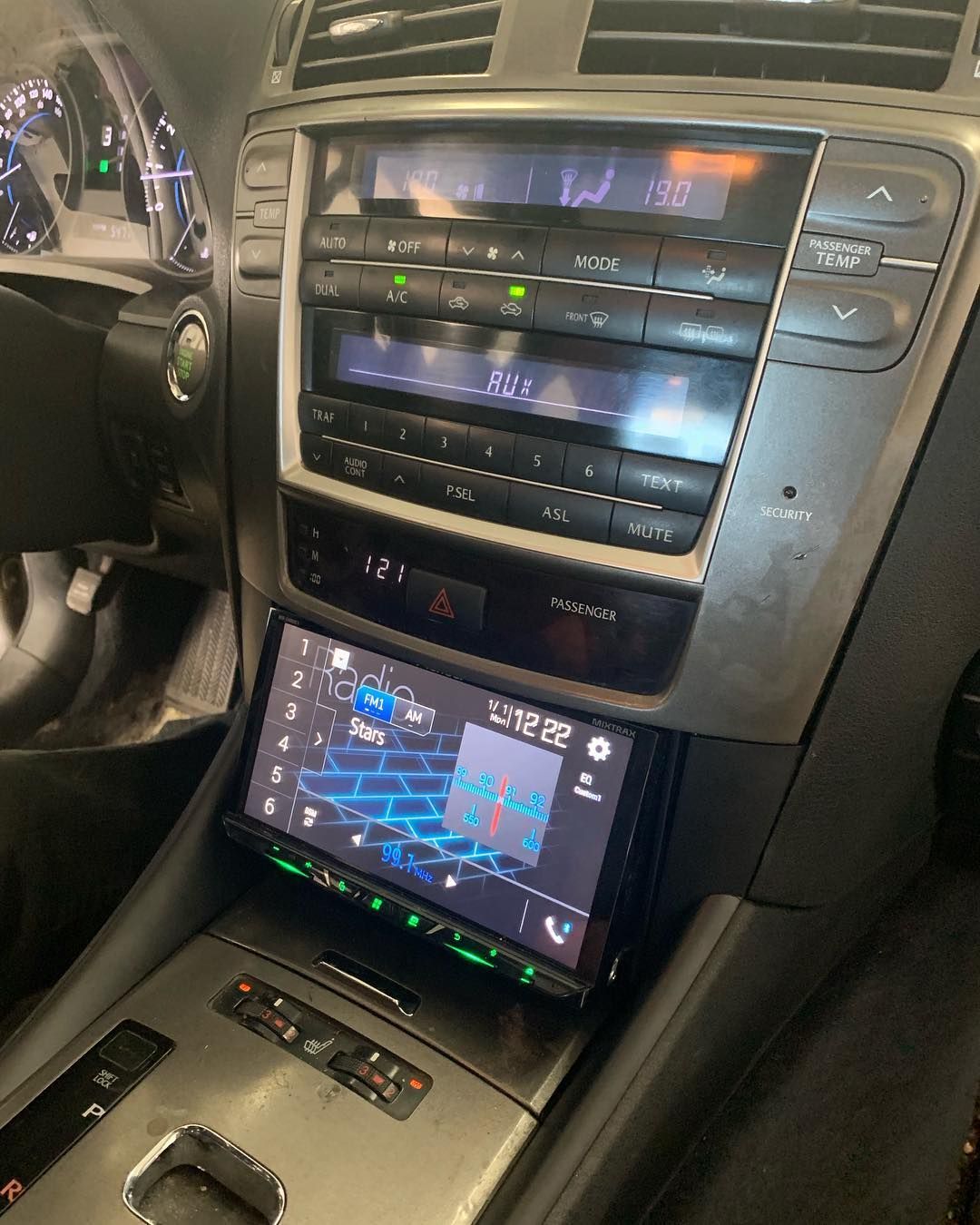 A car dashboard with a radio and a map on it.