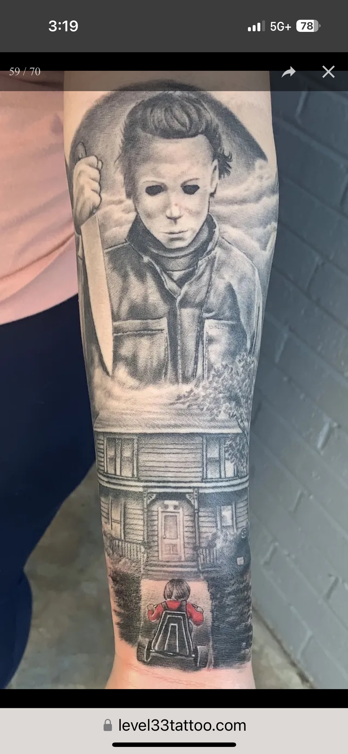 A person has a tattoo of michael myers on their forearm.