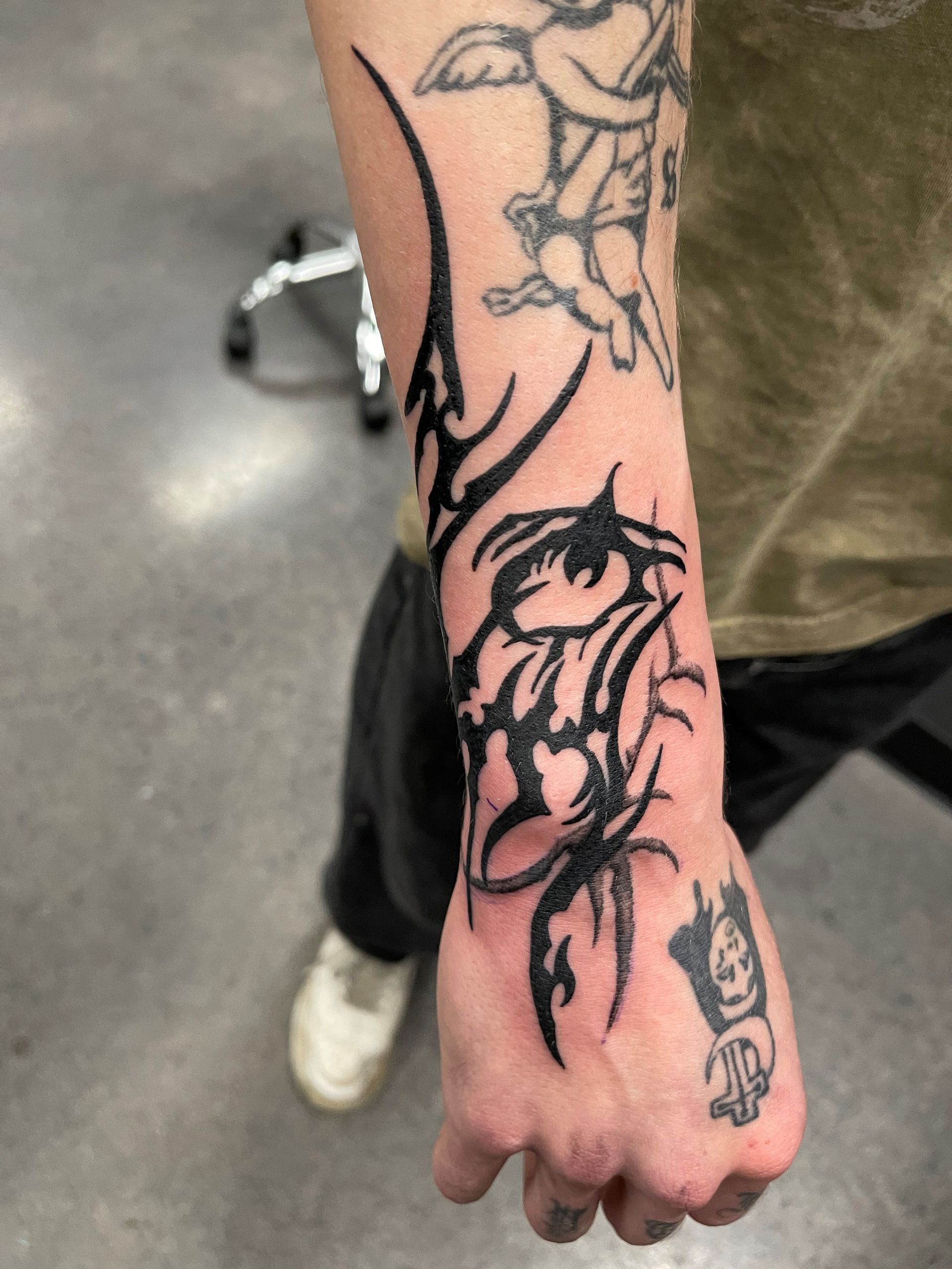 A man has a tattoo on his arm that says ' i love you '