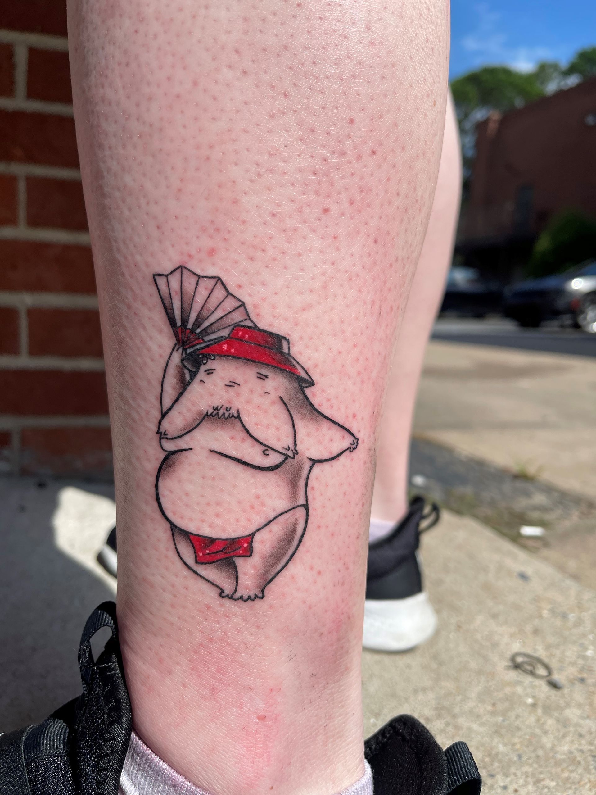 cartoon starfish that looks humanoid dancing with a fan