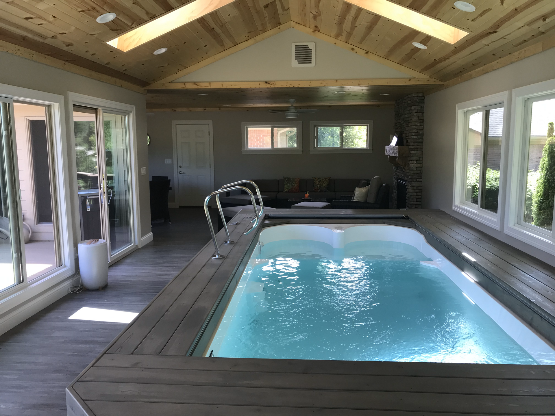 There is a large swimming pool in the middle of the room.