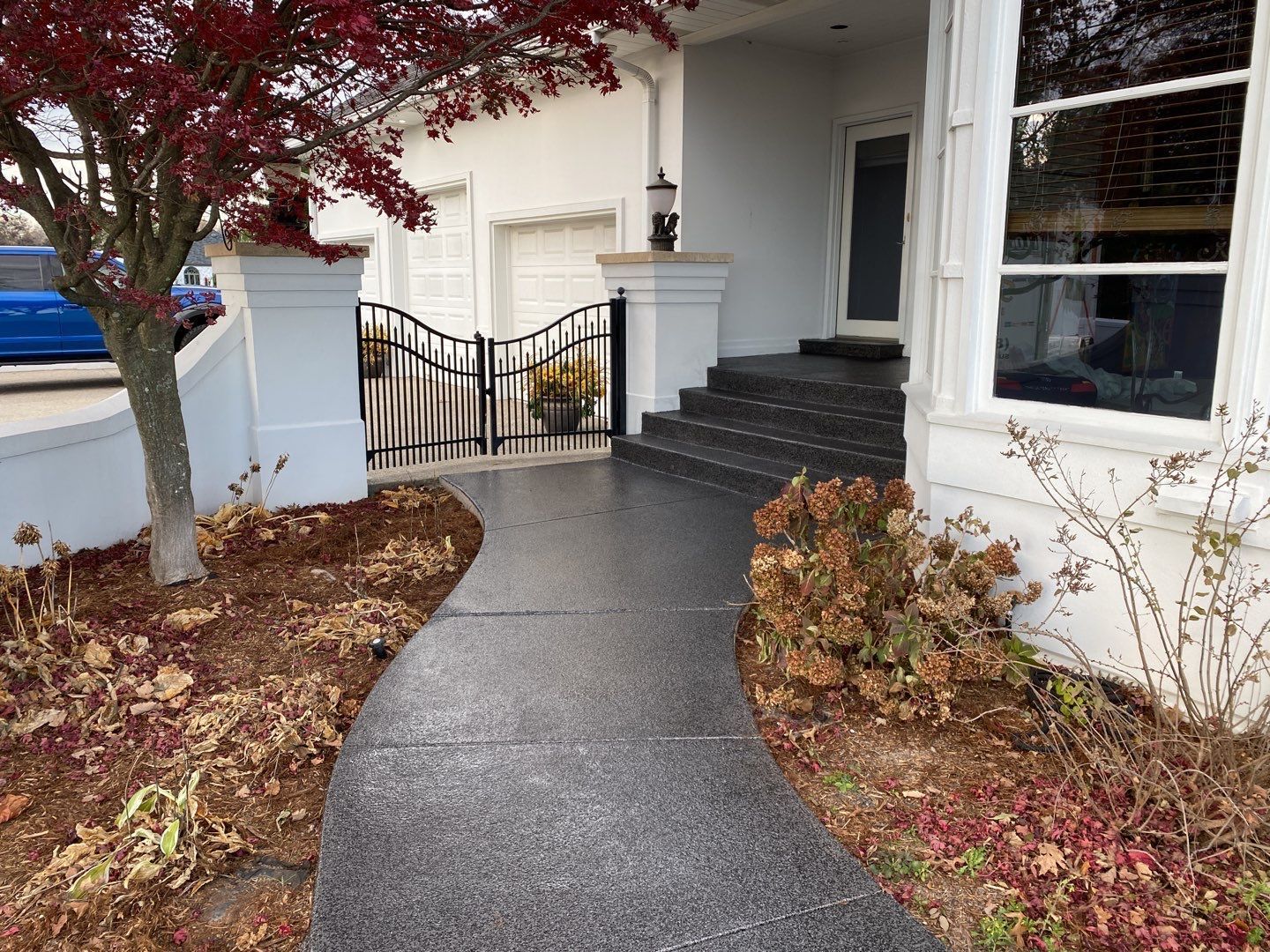 A walkway leading to the front door of a house