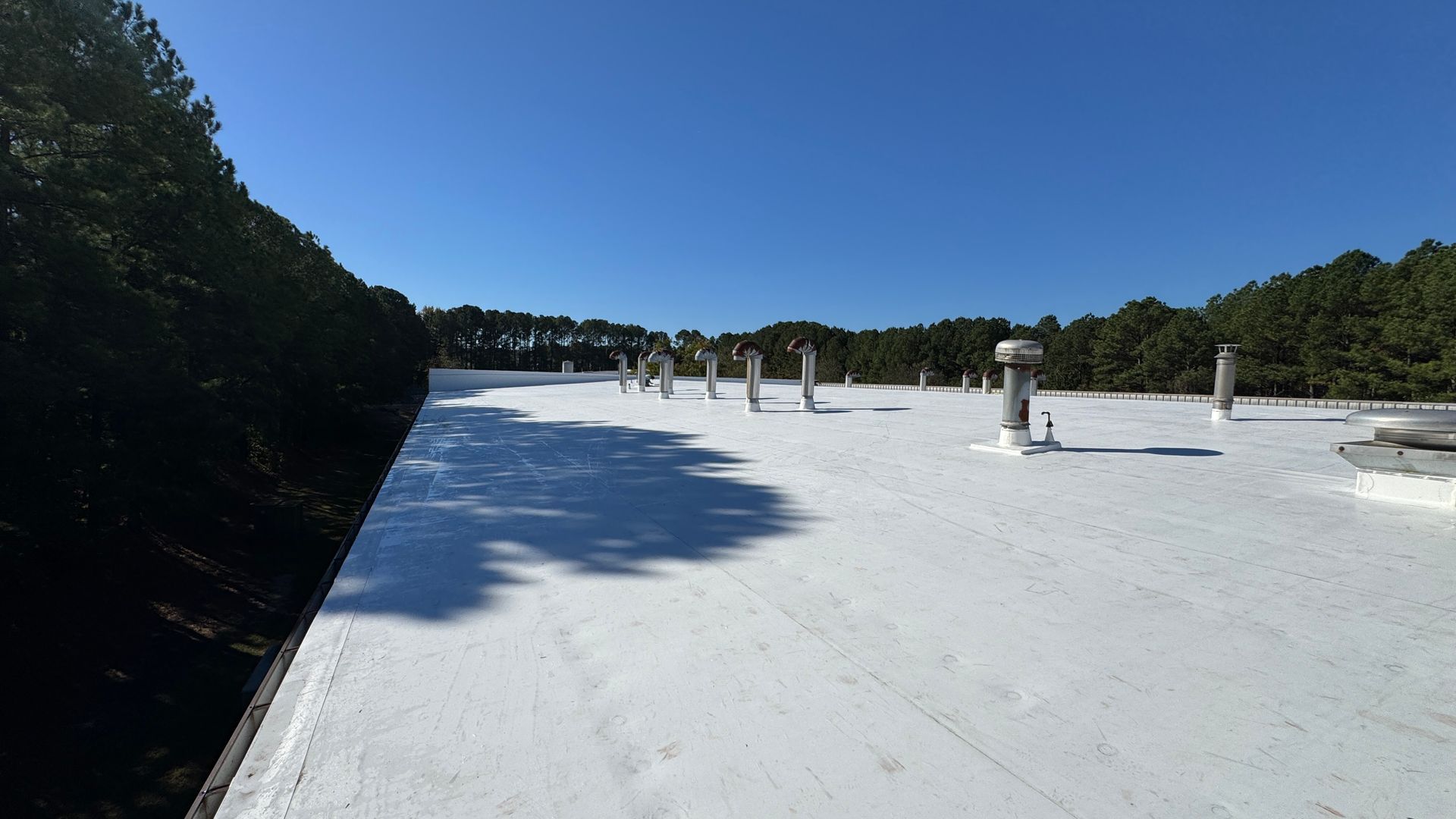 White metal retrofit roofing service.