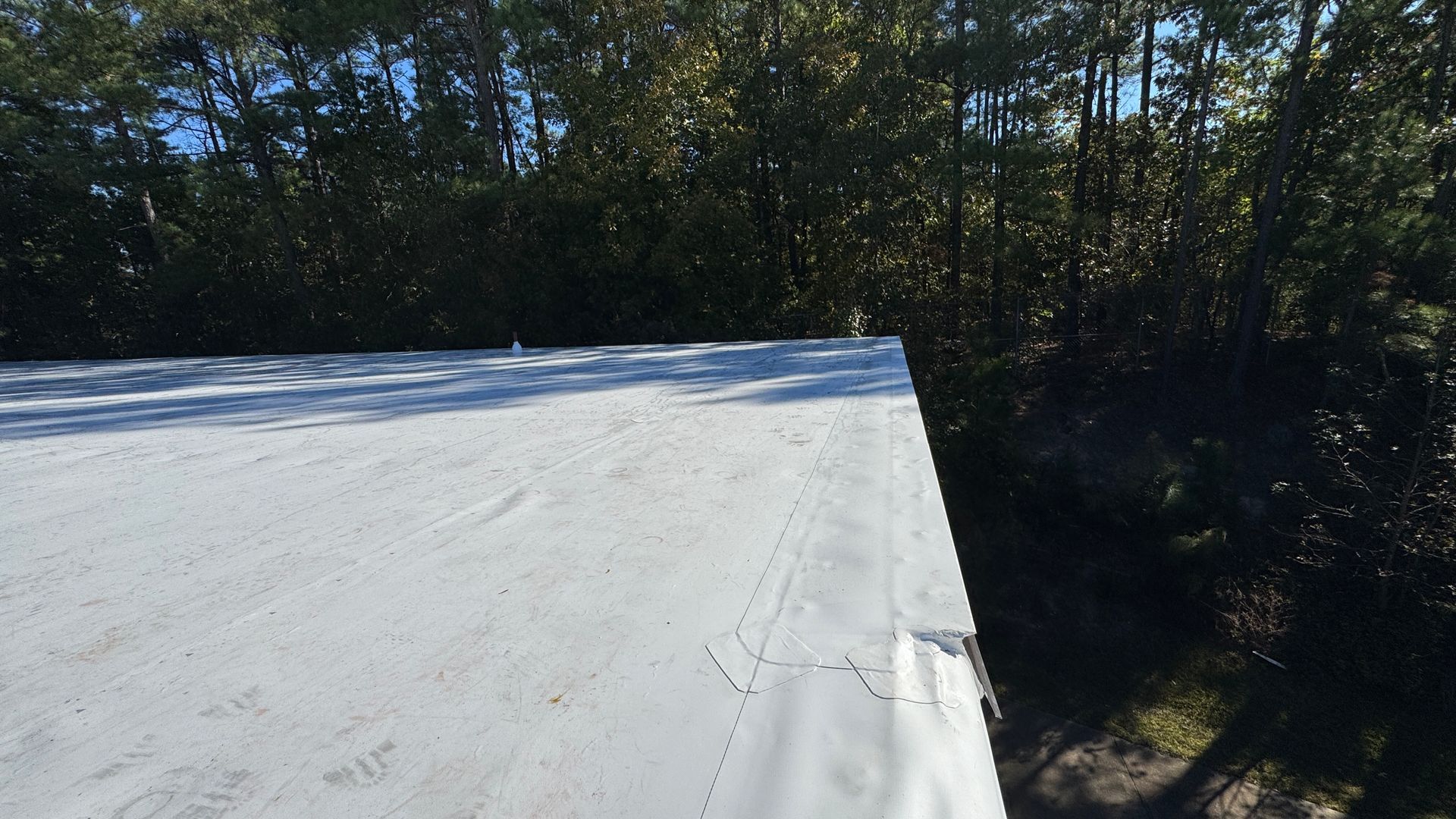 White metal retrofit roofing.