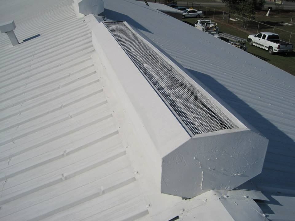White metal roof with a white ventilation structure.