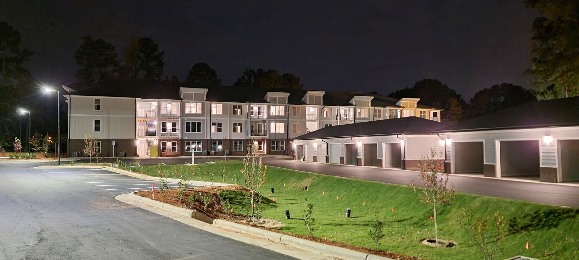 a large apartment building is lit up at night