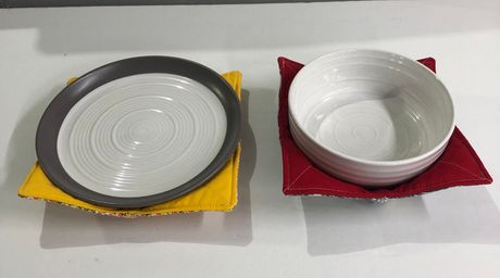 plate and a bowl are sitting on a table .