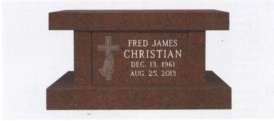 A brown granite headstone with the name Fred James Christian, dates Dec. 15, 1961 - Aug. 25, 2013, and a cross with praying hands.