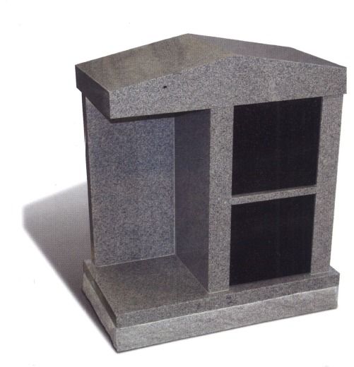 Gray granite columbarium with two black niches.