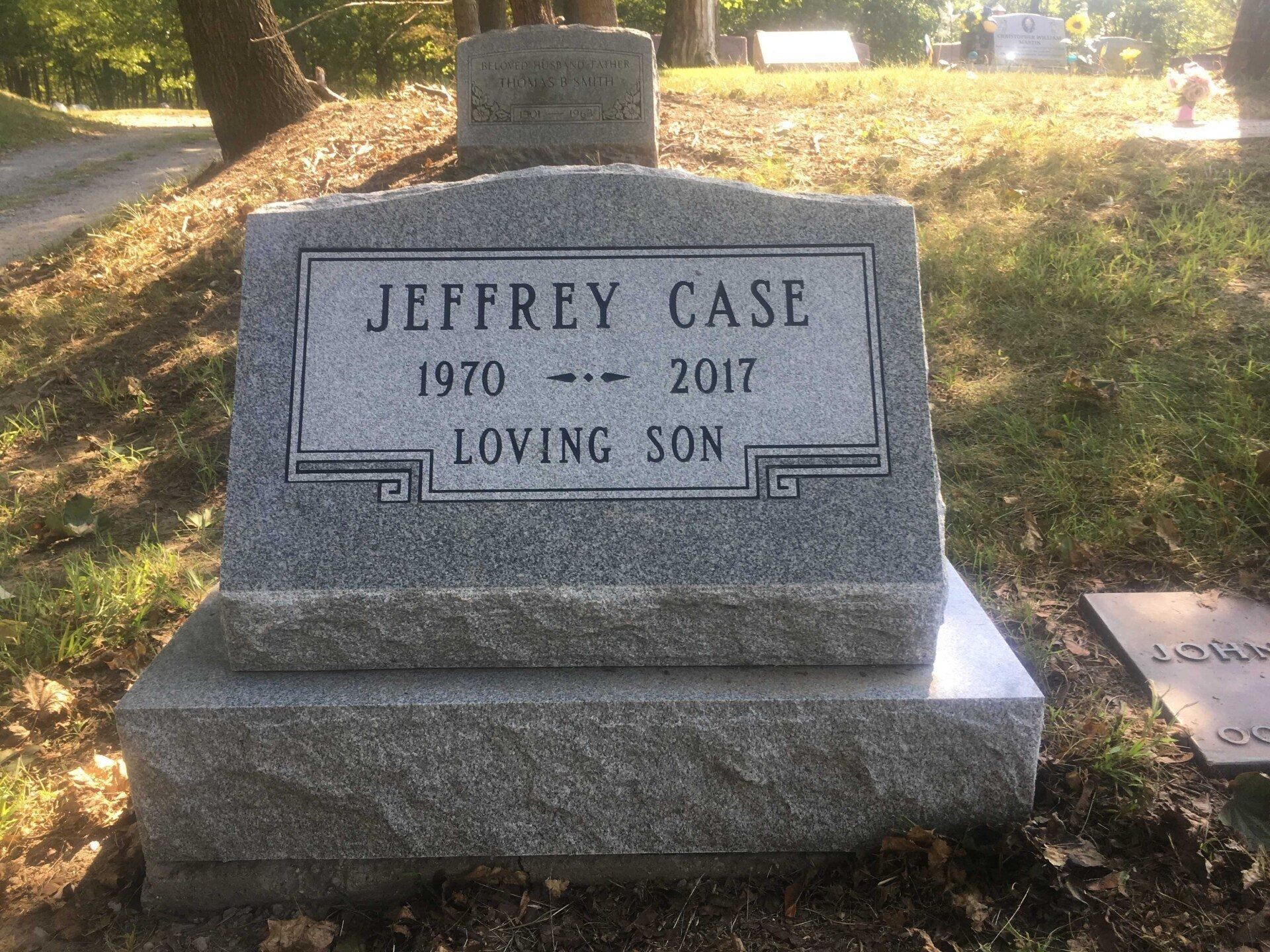 Gray granite tombstone: 