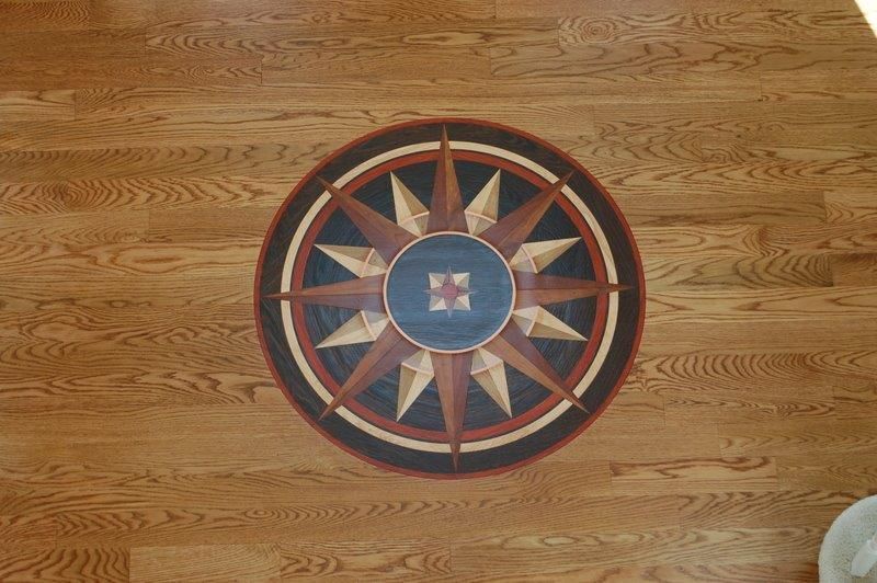 A wooden floor with a compass on it