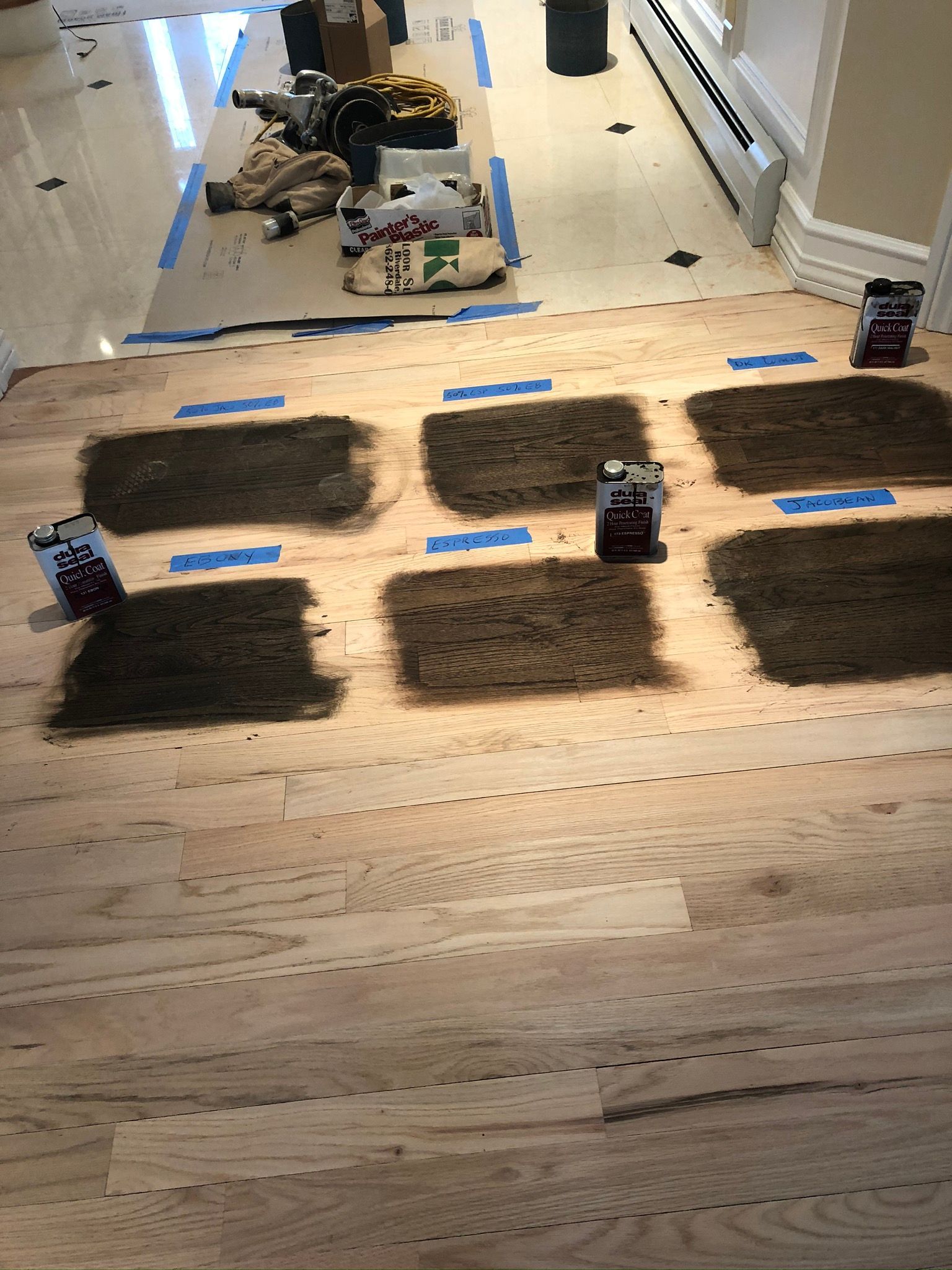A wooden floor is being installed in a room.