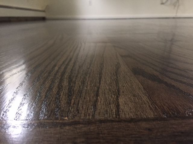 A close up of a wooden floor in a room.