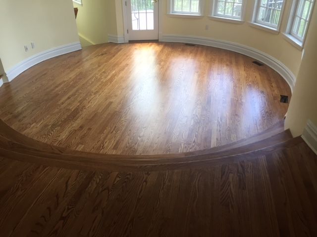There is a round wooden floor in the middle of the room.