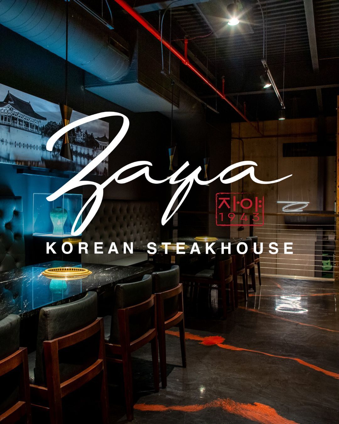 Zaya Korean Steakhouse sign over a dark, modern restaurant interior with blue lighting