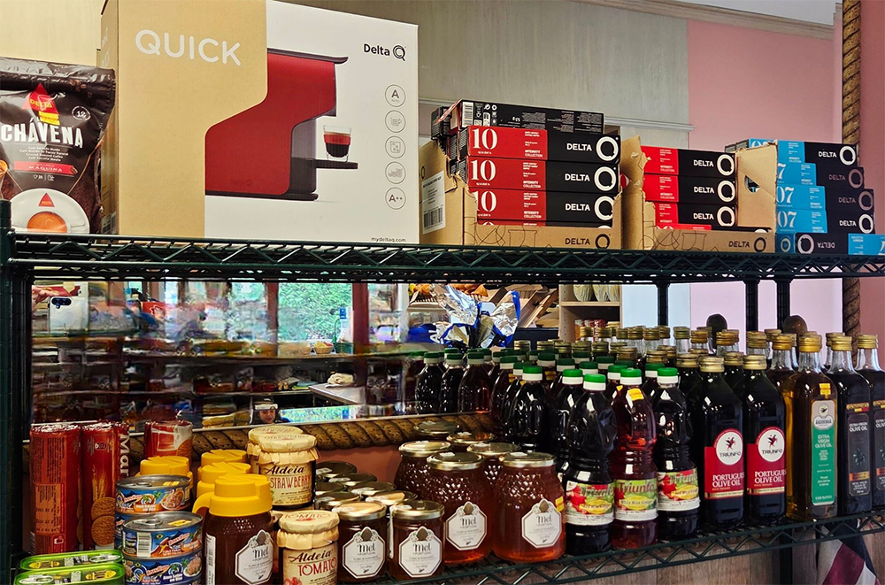 Shelves stocked with various food items including jars, bottles, coffee machine, and coffee pods.