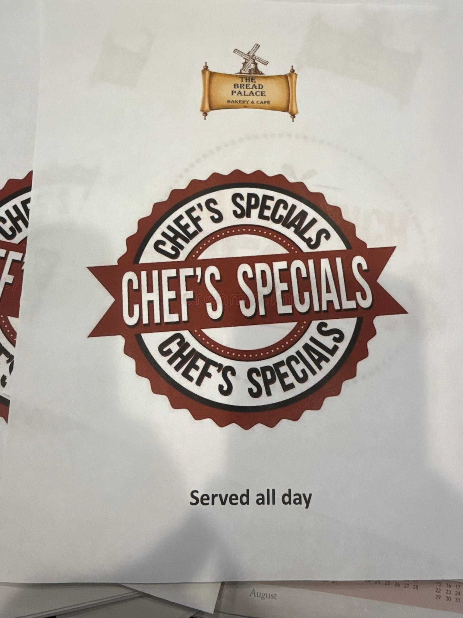 Chef's Specials sign in brown and white. Served all day.