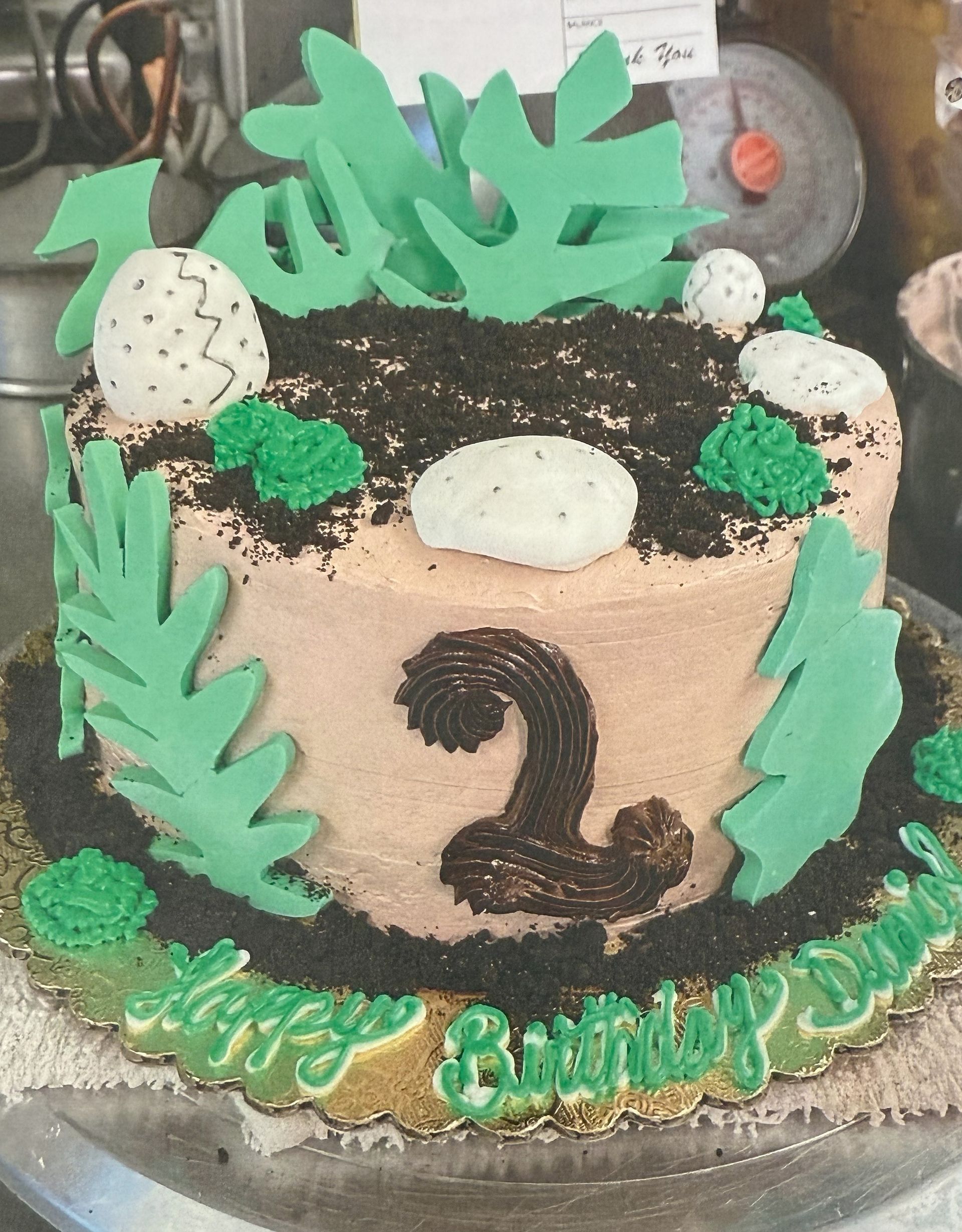 Dinosaur-themed birthday cake with 