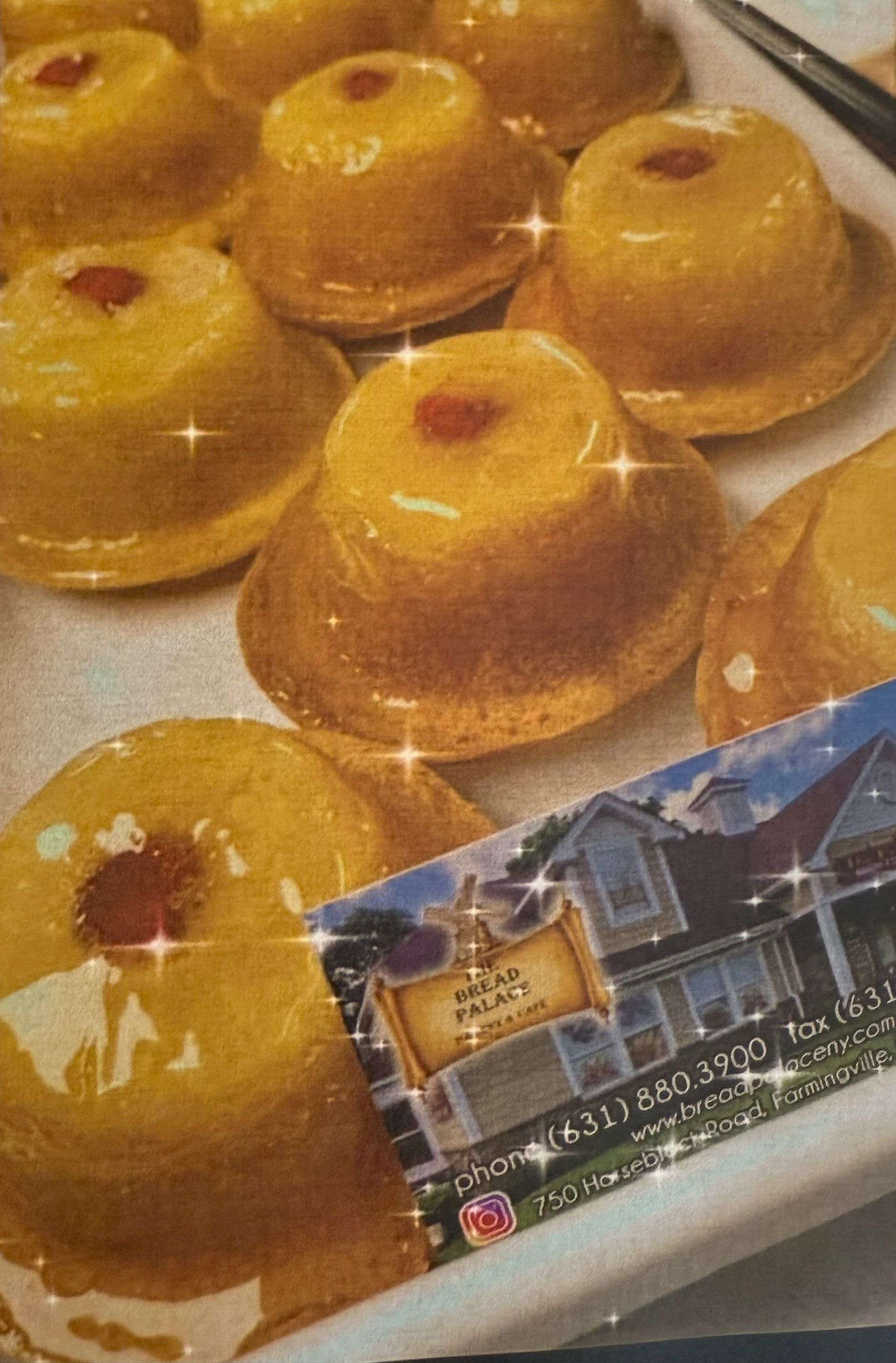 Pineapple upside-down cakes with a business card for Sugar Palace.