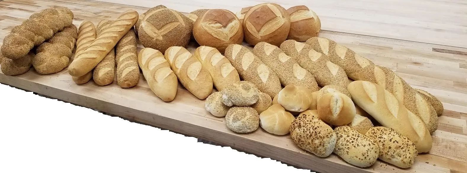 Various breads on a wooden surface.