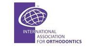 International Association for Orthodontics logo with purple globe and text