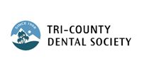 Tri-County Dental Society logo with blue mountain and bird icon and black text on white background
