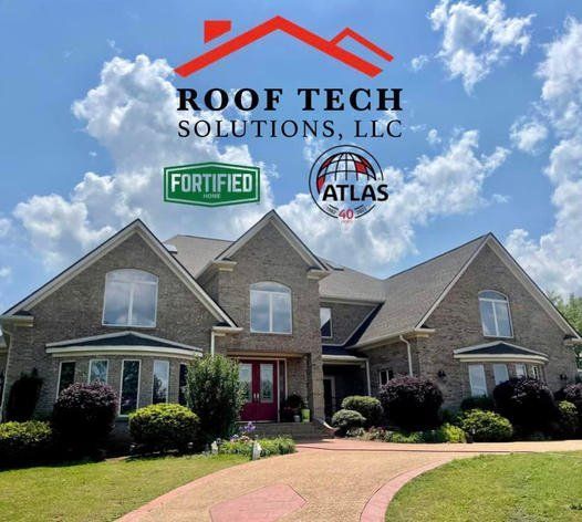 Roof Tech Solutions logo over a gray brick house with a landscaped front yard and blue sky