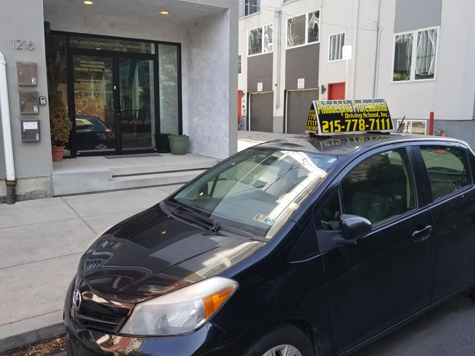 Black car parked in front of office
