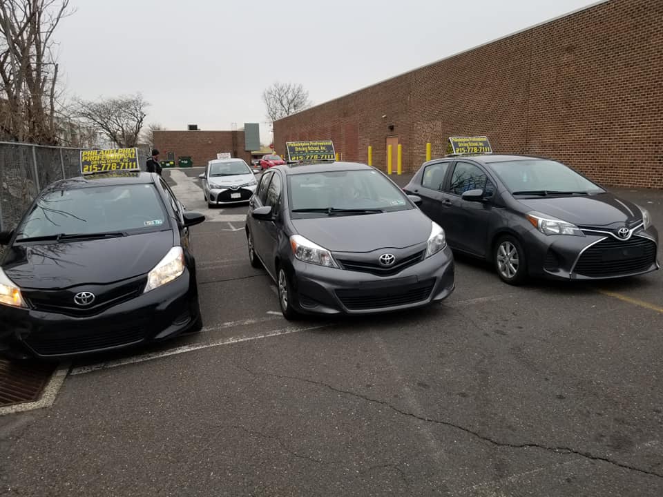 Three parked black cars