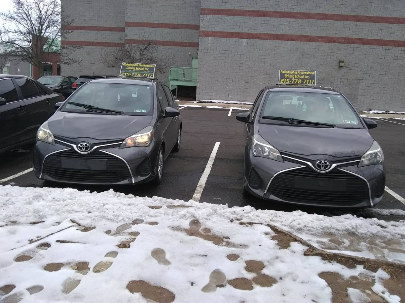 Two parked black cars