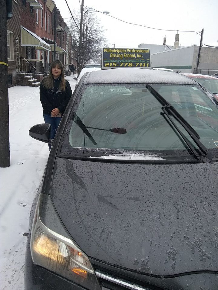 Woman wearing a black shirt successfully passed driving school test